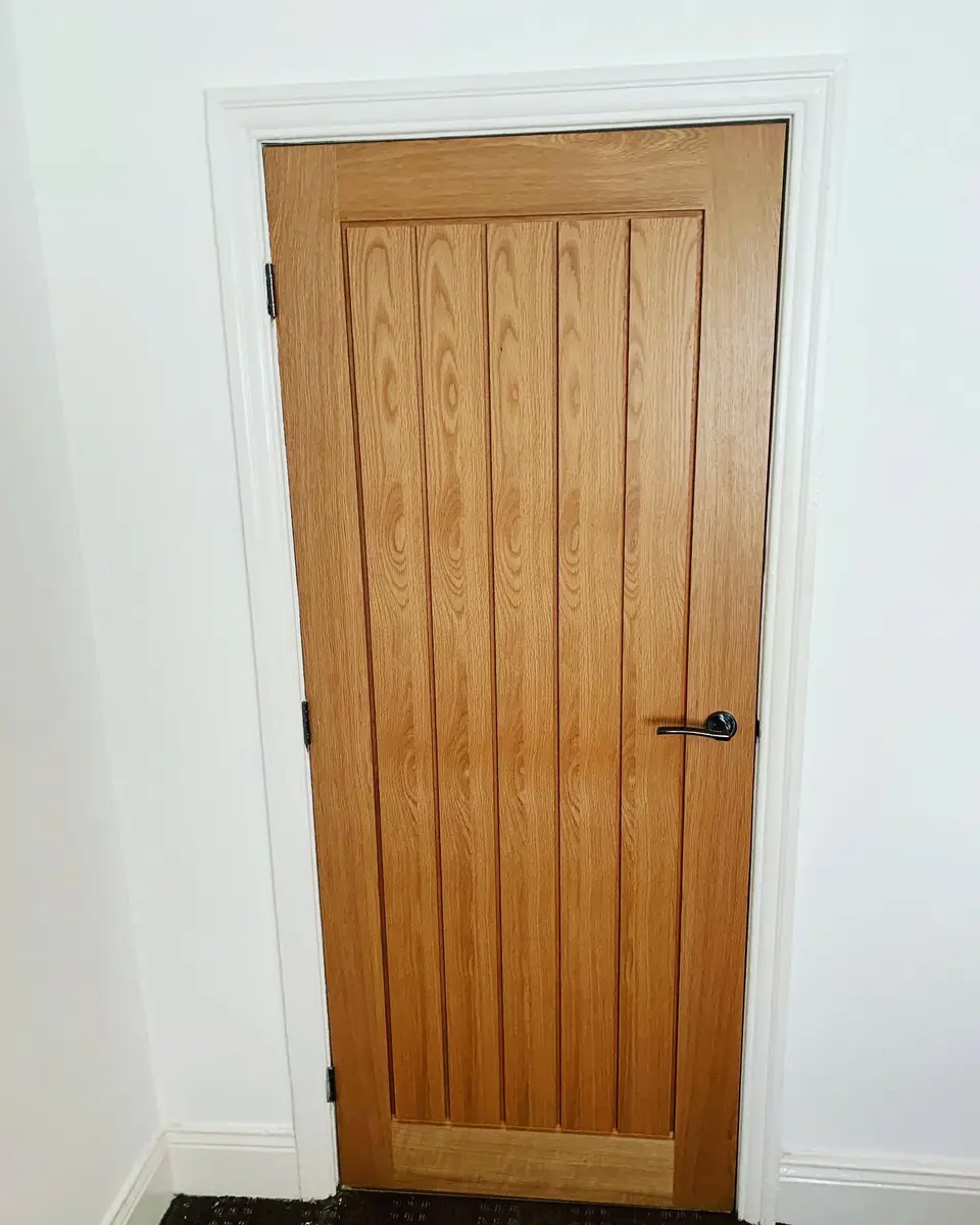 Oak cottage door in Newcastle Oak cottage-style vertical plank internal door in a Newcastle home
