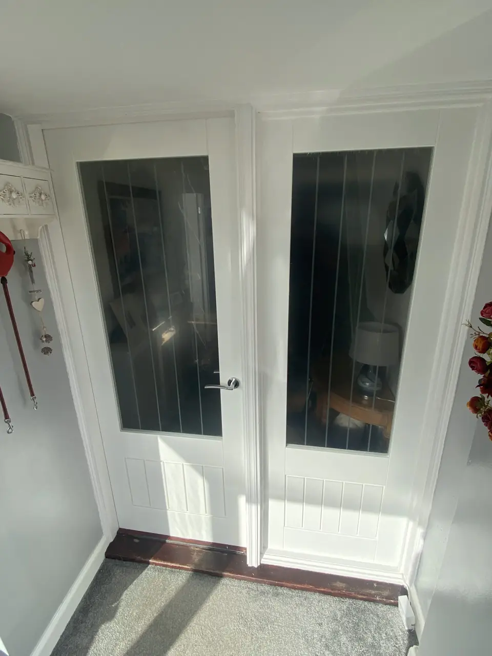 Glazed internal double doors in Newcastle Pair of white glazed internal double doors in a hallway in Newcastle upon Tyne